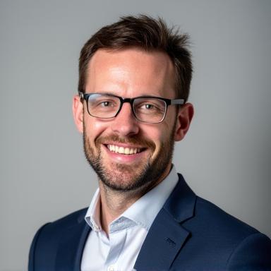 Professional headshot of Ben Carter.